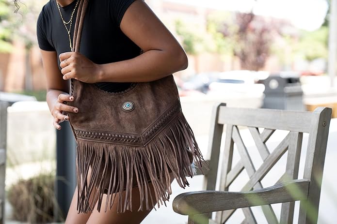 Model wearing black fringe Western tote – Jessie James Liberty concealed carry bag