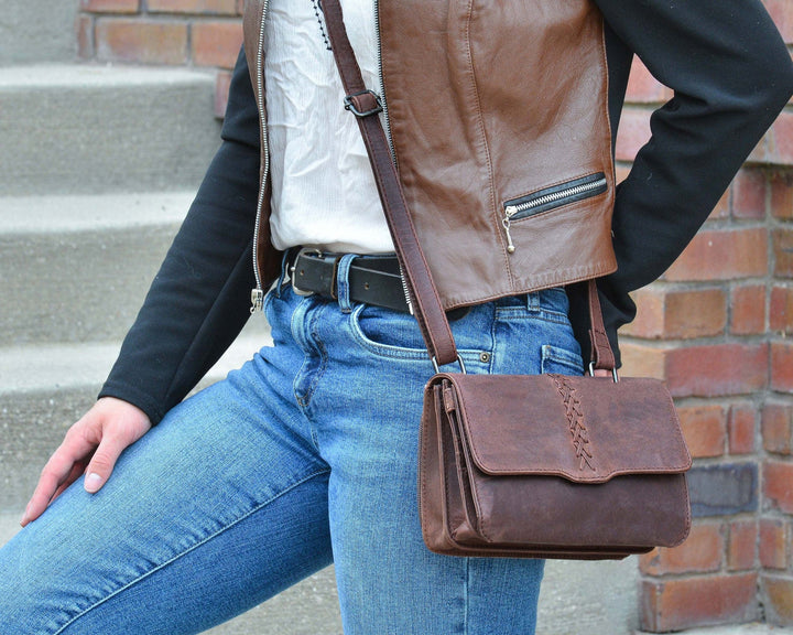 Woman wearing Mahogany Jolene concealed carry crossbody purse by Lady Conceal