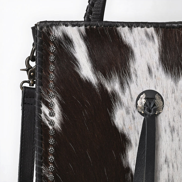 Close-up of ADBG1751 leather tote with zippered pocket, strap, open compartments, and soft leather. 