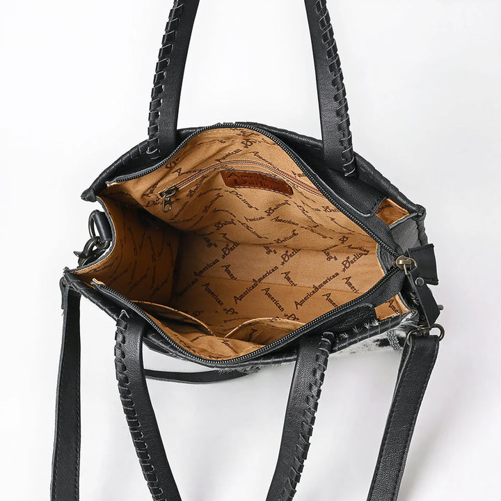 Interior of ADBG1751 leather tote with zippered pocket, open compartments, and soft fabric lining.