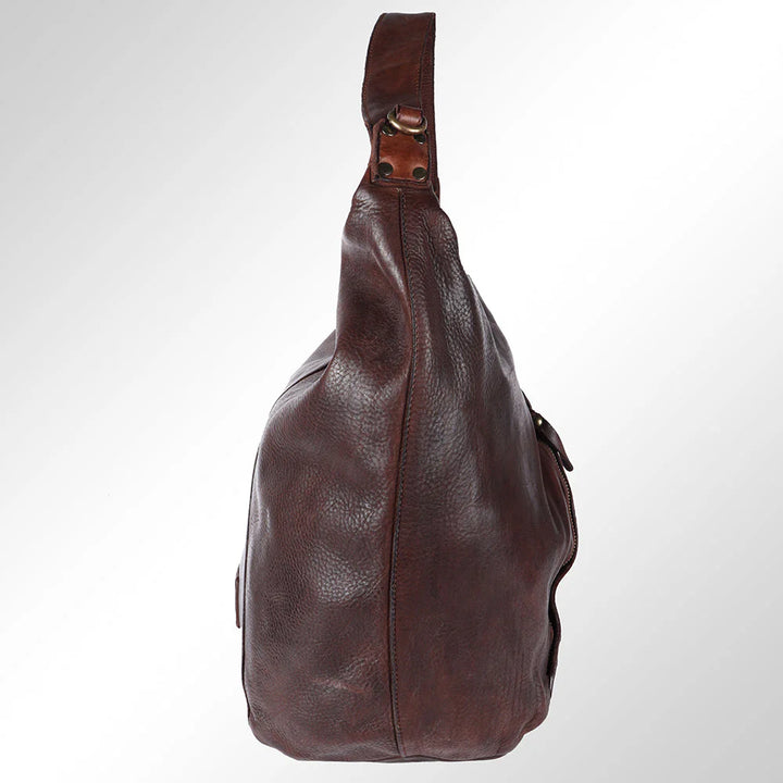 Side profile of brown leather hobo bag with slouchy shape and Western-inspired stitching from Rodeo Trends.