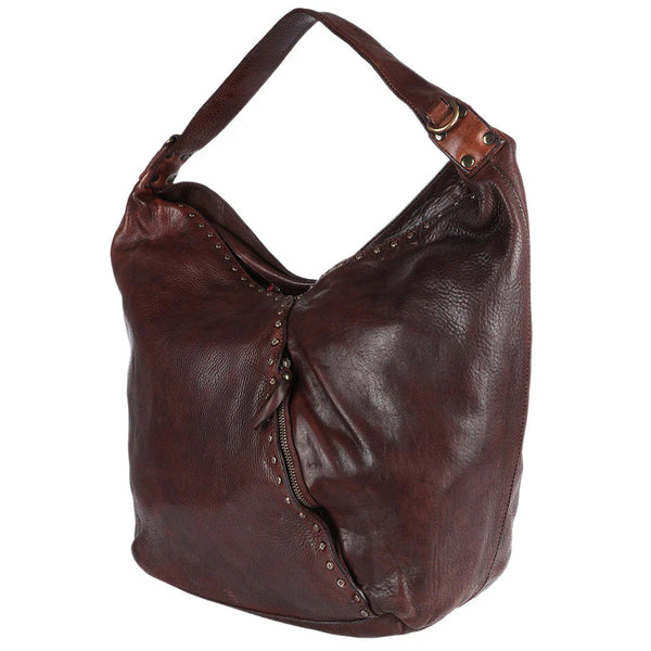 Side profile of brown leather hobo bag with slouchy shape and Western-inspired stitching from Rodeo Trends.