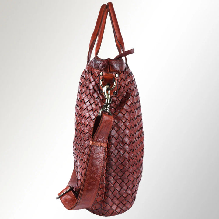 Side profile of Western tote bag featuring structured silhouette, genuine leather texture, and hand-tooled floral design.