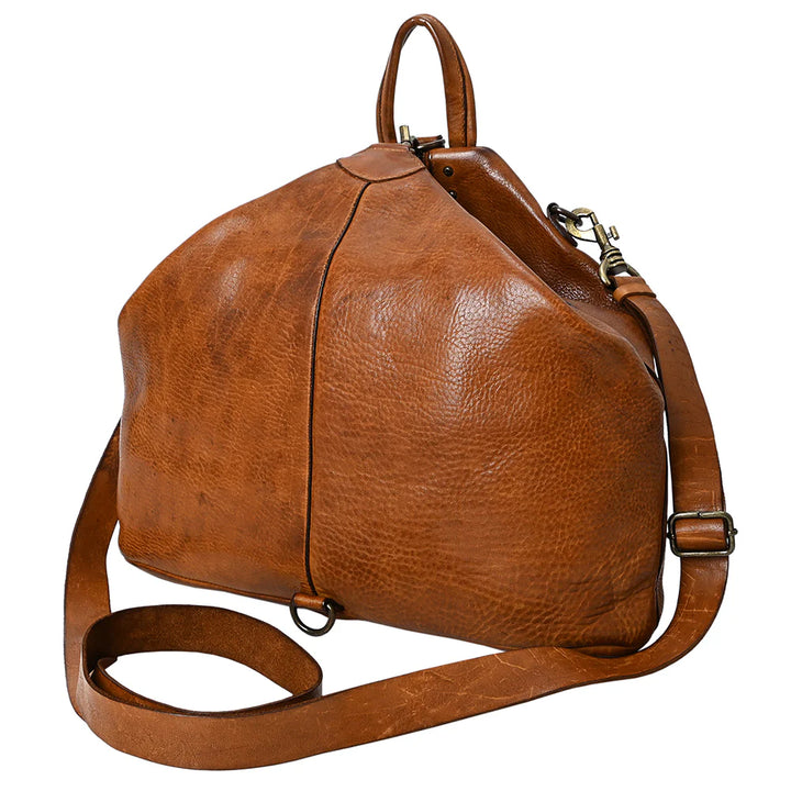 Side view of SWC194TAN crossbody bag showing structured profile, tooled leather detailing, and stitching.